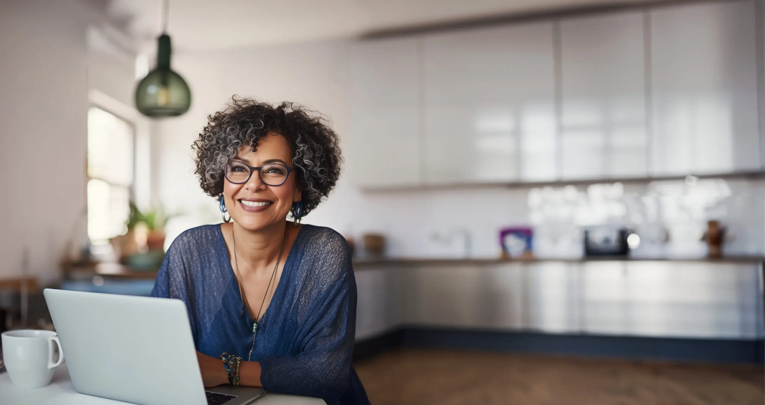 Middle Aged Woman Working from Home in her modern Kitchen women and retirement