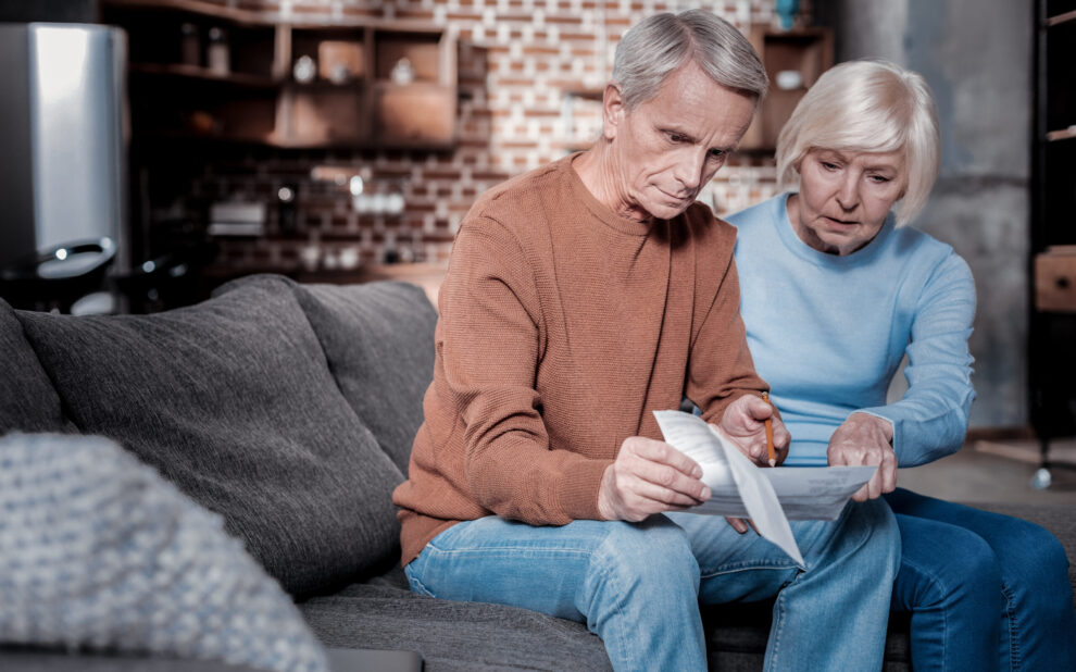 Serious man looking at savings