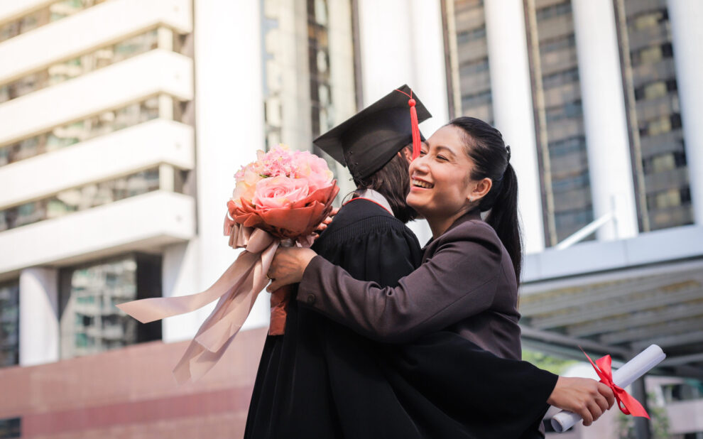 Mother congratulate her daughter, who finish their studies at the university ceremony 4 Ways to Help Your New Graduate Become Financially Independent
