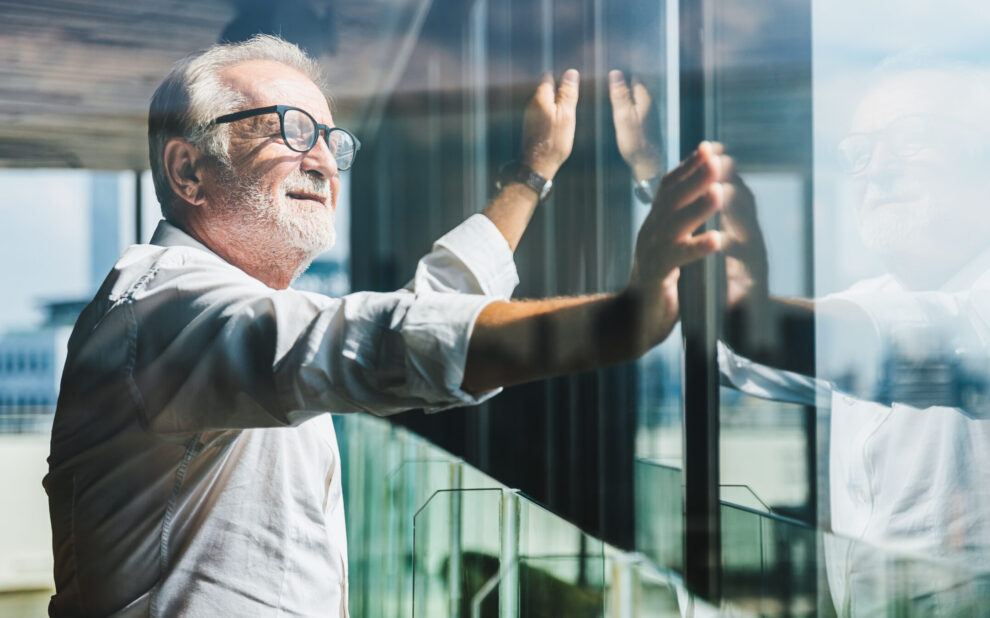 Retirement concept. Senior grey-haired businessman standing and SEP-IRA