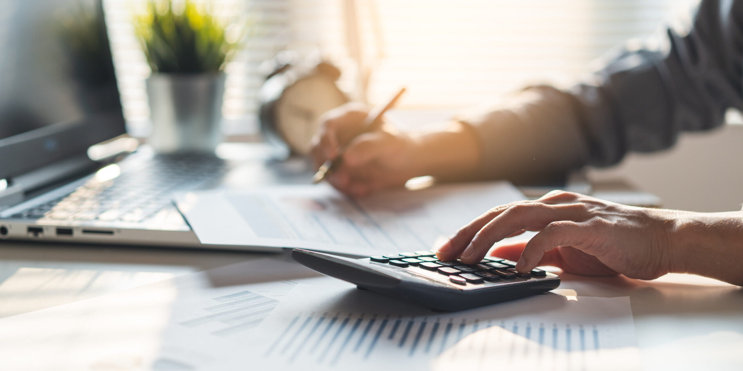 Tax deduction planning concept. Businessman calculating business Tax-Loss Harvesting