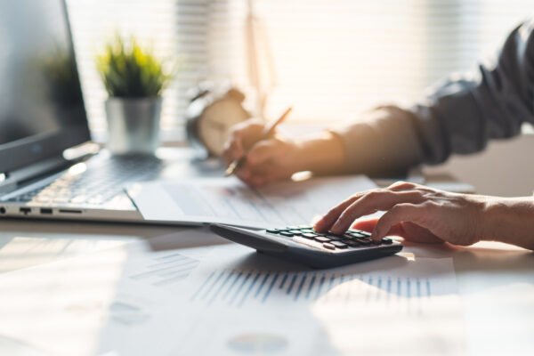 Tax deduction planning concept. Businessman calculating business Tax-Loss Harvesting