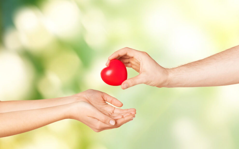 woman and man hands with heart