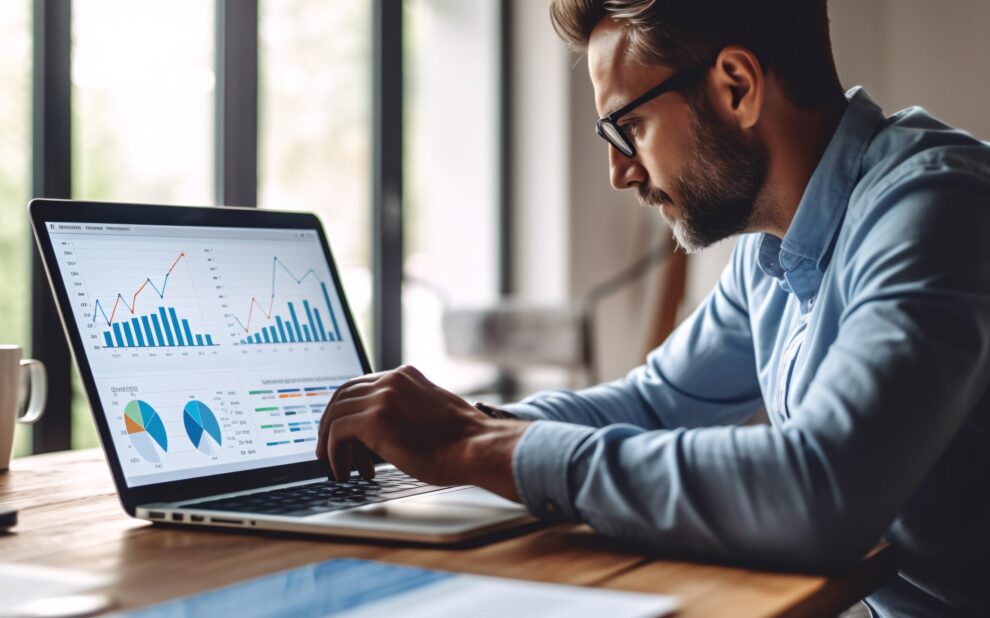 Data analysis to increase sales and revenue. Man sitting with laptop and working with growing graph. Business data analytics concept. Generative ai.