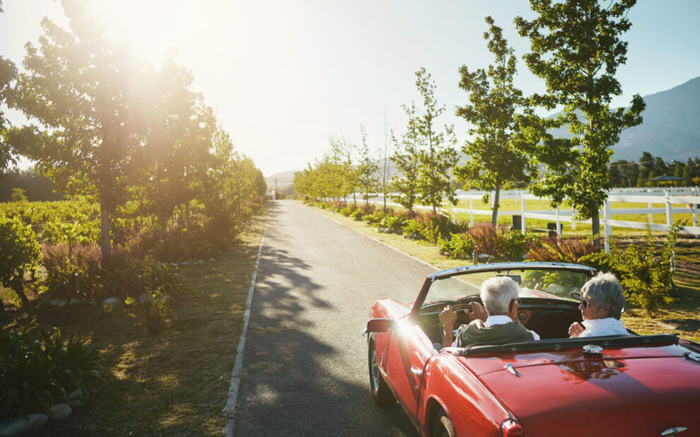 Couple, convertible and driving road trip or travel journey to California vineyard, adventure or transportation. People, nature and tourism holiday for explore together in retirement, morning or love Catch-Up Contributions
